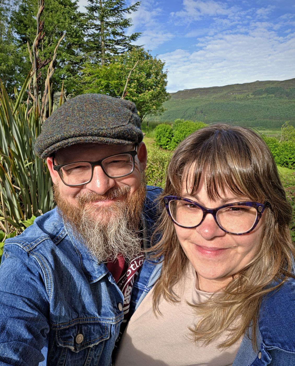 Carlton and Ashley smiling together in the Scottish Highlands